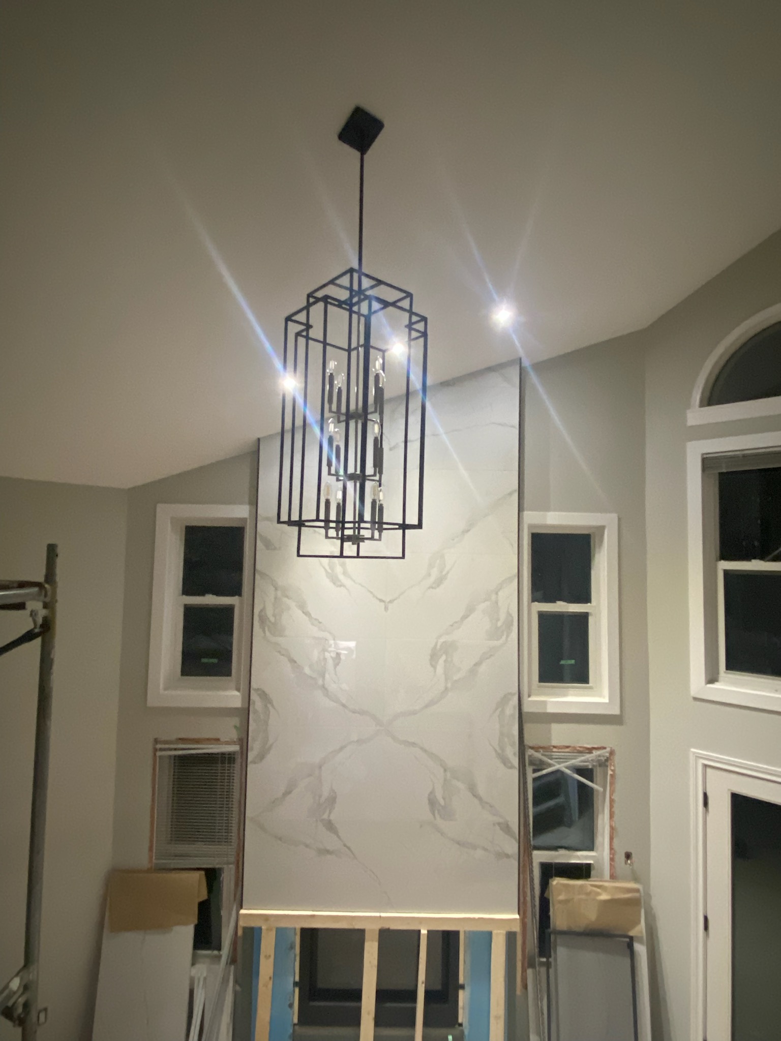 The after of a custom wall and lighting installation as part of a living room installation
